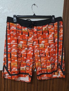 Nike Men’s Orange and Black Graphic Swim Shorts